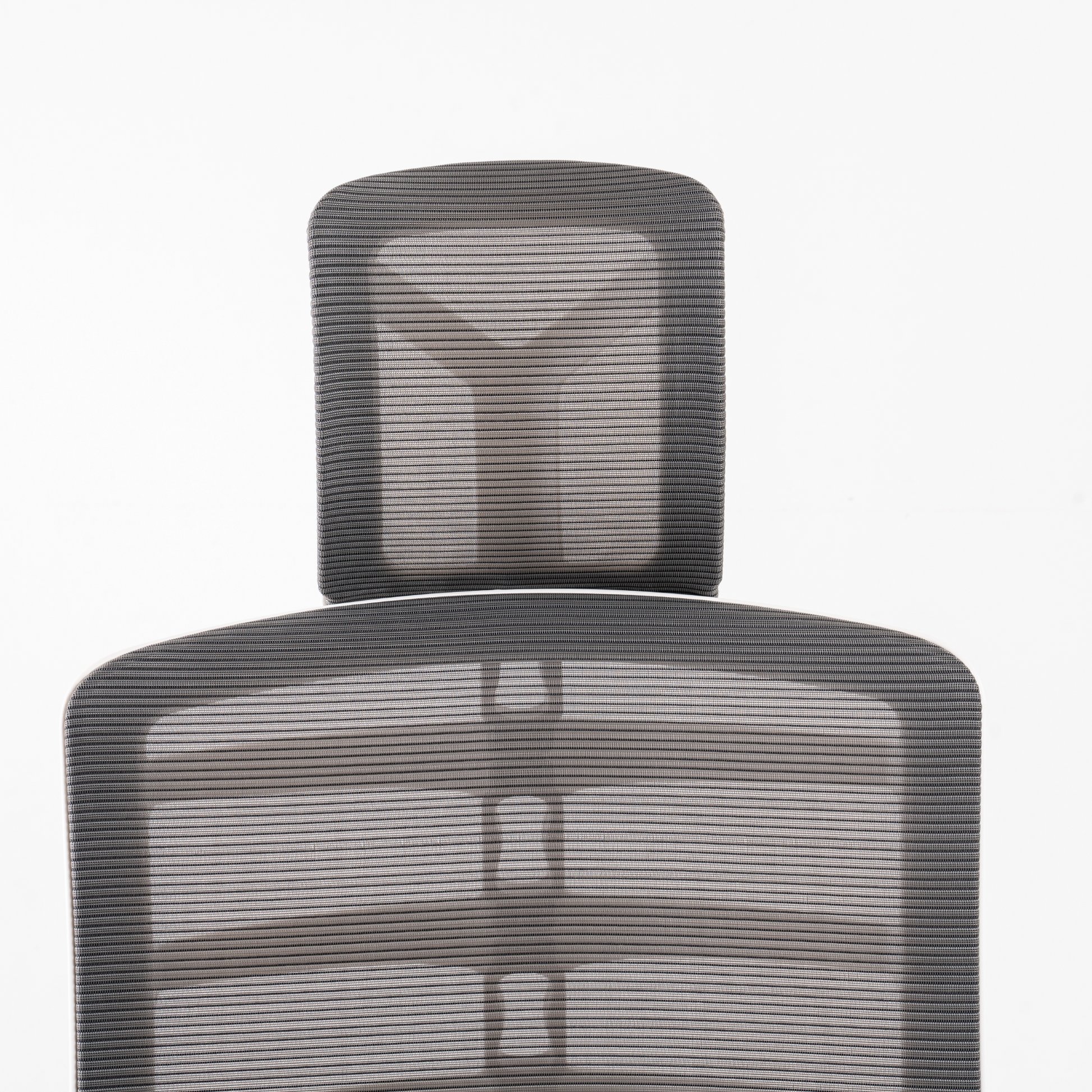 Headrest: Polypropylene (100% recyclable)  frame in black or white colour  option. Polyelastomer/Nylon/ Polyester mesh in Jet grey colour.